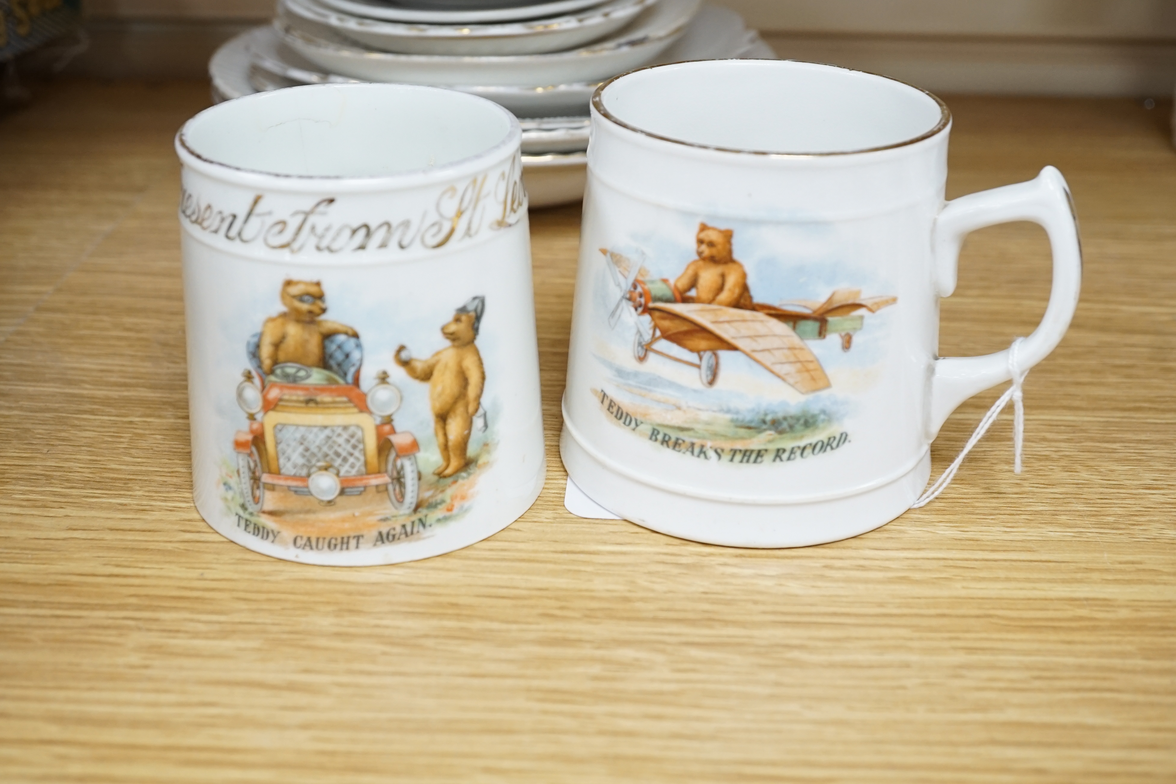 Nineteen plates, bowls, saucers, two cups and saucers, three mugs, one cup and a miniature teapot